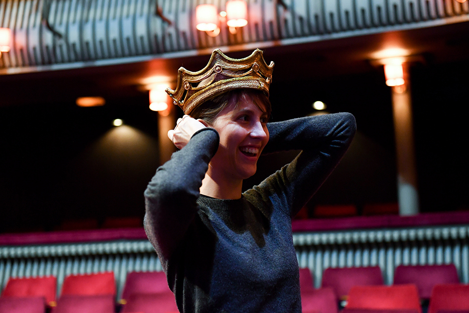 RCM student trying on a crown in the Britten Theatre